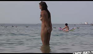 Aliment added to Despondent Naked Strand Babes tanning spied on with voyeur cam