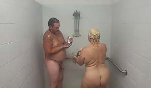 Husband and wife taking a shower with a quickie.