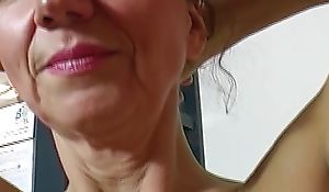 Old but sultry German lady dildoing her shaved twat